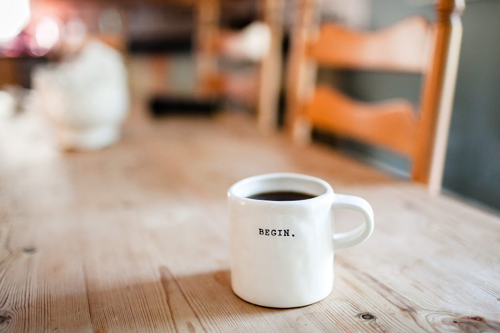 coffee mug with word begin on it