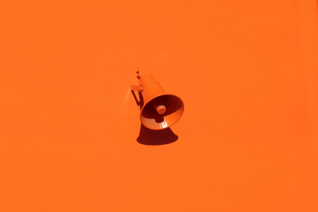 Megaphone on orange background